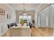 Dining room features hardwood floors, elegant chandelier, and wainscotting at 1868 Birch Briar Bnd, Lawrenceville, GA 30043