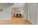 Open foyer with hardwood floors leads to an elegant dining room with chandelier at 1868 Birch Briar Bnd, Lawrenceville, GA 30043