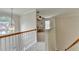 Bright hallway featuring a large arched window and a view into a room with a built-in desk at 1868 Birch Briar Bnd, Lawrenceville, GA 30043