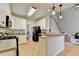 Modern kitchen featuring white cabinetry, stainless steel appliances, and convenient access to the breakfast area and living room at 1868 Birch Briar Bnd, Lawrenceville, GA 30043