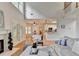 Comfortable living room with hardwood floors, fireplace, and views of the breakfast area and kitchen at 1868 Birch Briar Bnd, Lawrenceville, GA 30043
