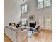 Spacious living room with fireplace, high ceilings, and hardwood floors at 1868 Birch Briar Bnd, Lawrenceville, GA 30043