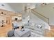 Spacious living room with hardwood floors, staircase access, and seamless transition to the kitchen and dining area at 1868 Birch Briar Bnd, Lawrenceville, GA 30043