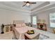 Bright main bedroom featuring a tray ceiling, neutral walls, and large windows for natural light at 1868 Birch Briar Bnd, Lawrenceville, GA 30043