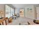 Bright main bedroom featuring neutral paint, large windows with natural light, and a view to the primary bathroom at 1868 Birch Briar Bnd, Lawrenceville, GA 30043