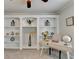 Bright office featuring a ceiling fan, built-in bookshelves, and a modern desk with decor at 1868 Birch Briar Bnd, Lawrenceville, GA 30043