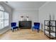 Cozy sitting room features hardwood floors, large windows, and elegant decor at 1868 Birch Briar Bnd, Lawrenceville, GA 30043