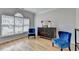 Sitting room featuring hardwood floors, large windows, and stylish decor at 1868 Birch Briar Bnd, Lawrenceville, GA 30043