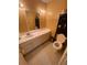 Bathroom featuring a toilet, single sink vanity, mirror, and tile flooring at 2009 Oak Park Ln, Decatur, GA 30032