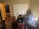Bedroom is shown with furniture, boxes, and assorted belongings at 2009 Oak Park Ln, Decatur, GA 30032