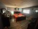 This bedroom features modern gray walls, wood flooring, and a beautiful artwork piece above the bed at 2009 Oak Park Ln, Decatur, GA 30032