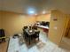 View of open-concept dining area with modern tile flooring, adjacent to breakfast bar at 2009 Oak Park Ln, Decatur, GA 30032
