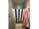 This shower has a blue and white striped towel hanging from the curtain rod at 2009 Oak Park Ln, Decatur, GA 30032