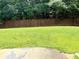 Spacious backyard with a wooden privacy fence at 4460 Greycliff Pte, Douglasville, GA 30135