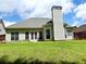 Expansive backyard with well-maintained lawn and exterior of home at 4460 Greycliff Pte, Douglasville, GA 30135