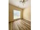 Bright bedroom features new wood-look flooring and a ceiling fan at 4460 Greycliff Pte, Douglasville, GA 30135