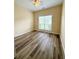 Bright bedroom features new wood-look flooring and a ceiling fan at 4460 Greycliff Pte, Douglasville, GA 30135