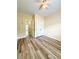 Bright bedroom features new wood-look flooring and a ceiling fan and closet at 4460 Greycliff Pte, Douglasville, GA 30135
