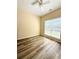 Bright bedroom features new wood-look flooring and a ceiling fan at 4460 Greycliff Pte, Douglasville, GA 30135