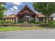 Stunning clubhouse with timber frame entry and lush landscaping at 4460 Greycliff Pte, Douglasville, GA 30135