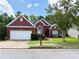 Charming brick home featuring a well-manicured lawn and a two-car garage at 4460 Greycliff Pte, Douglasville, GA 30135