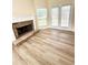 Living room fireplace with white mantel and stone surround at 4460 Greycliff Pte, Douglasville, GA 30135