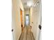 Hallway features wood flooring and leads to multiple rooms at 4460 Greycliff Pte, Douglasville, GA 30135