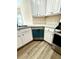 Galley kitchen features new stainless steel appliances and modern vinyl flooring at 4460 Greycliff Pte, Douglasville, GA 30135
