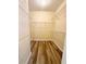 Spacious walk-in closet with installed shelving and wood flooring at 4460 Greycliff Pte, Douglasville, GA 30135