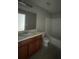 Bathroom features include a shower and tub combination, a dark wood vanity, white sink, and tile floors at 6361 Redan Sq, Lithonia, GA 30058