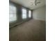Bedroom features include neutral carpet and freshly painted walls, as well as a window for natural light at 6361 Redan Sq, Lithonia, GA 30058