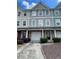 Charming townhome with a one car garage and a well maintained front yard at 6361 Redan Sq, Lithonia, GA 30058