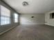 Neutral living room with standard carpet flooring and plenty of natural light at 6361 Redan Sq, Lithonia, GA 30058