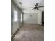 Neutral living room with standard carpet flooring and plenty of natural light at 6361 Redan Sq, Lithonia, GA 30058