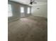 Neutral living room with standard carpet flooring and plenty of natural light at 6361 Redan Sq, Lithonia, GA 30058