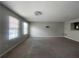 Neutral living room with standard carpet flooring and plenty of natural light at 6361 Redan Sq, Lithonia, GA 30058