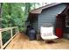 Enjoy outdoor relaxation with a chair on the back deck, complete with grill at 1310 Larkview Sw Dr, Lilburn, GA 30047