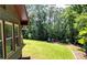Enjoy backyard views with a lush lawn and mature trees in a tranquil setting at 1310 Larkview Sw Dr, Lilburn, GA 30047