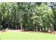 Lush, wooded backyard offers privacy and serene enjoyment in a natural setting at 1310 Larkview Sw Dr, Lilburn, GA 30047
