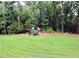 Backyard complete with a wooden playset for outdoor fun and entertainment at 1310 Larkview Sw Dr, Lilburn, GA 30047