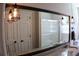 Bathroom features a granite countertop, large mirror, and updated fixtures and shower at 1310 Larkview Sw Dr, Lilburn, GA 30047