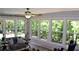 Bright sunroom filled with natural light, comfortable seating, and large windows with backyard views at 1310 Larkview Sw Dr, Lilburn, GA 30047