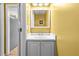 Bathroom with vanity, light fixtures, sink and mirror at 305 Hickory Pointe Ct, Villa Rica, GA 30180