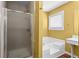 Bathroom featuring glass door shower, bathtub, and window at 305 Hickory Pointe Ct, Villa Rica, GA 30180