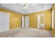 Bedroom with tray ceiling, ceiling fan, carpet and ensuite bathroom at 305 Hickory Pointe Ct, Villa Rica, GA 30180