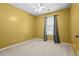 Cozy bedroom with a large window and soft, neutral carpet at 305 Hickory Pointe Ct, Villa Rica, GA 30180