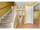 Hallway with staircase featuring carpet and view to dining room at 305 Hickory Pointe Ct, Villa Rica, GA 30180