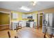 Eat-in kitchen with stainless steel refrigerator and white cabinets at 305 Hickory Pointe Ct, Villa Rica, GA 30180