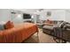 Cozy bedroom with modern decor, wood floors, and an oversized sectional sofa at 5016 Comanche Nw Ct, Lilburn, GA 30047