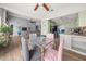Open-concept dining area with views of the kitchen and living room, perfect for entertaining at 5016 Comanche Nw Ct, Lilburn, GA 30047